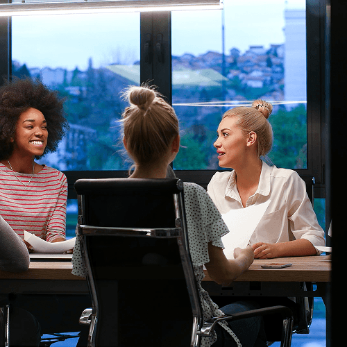 A small group of business professionals sitting at a table