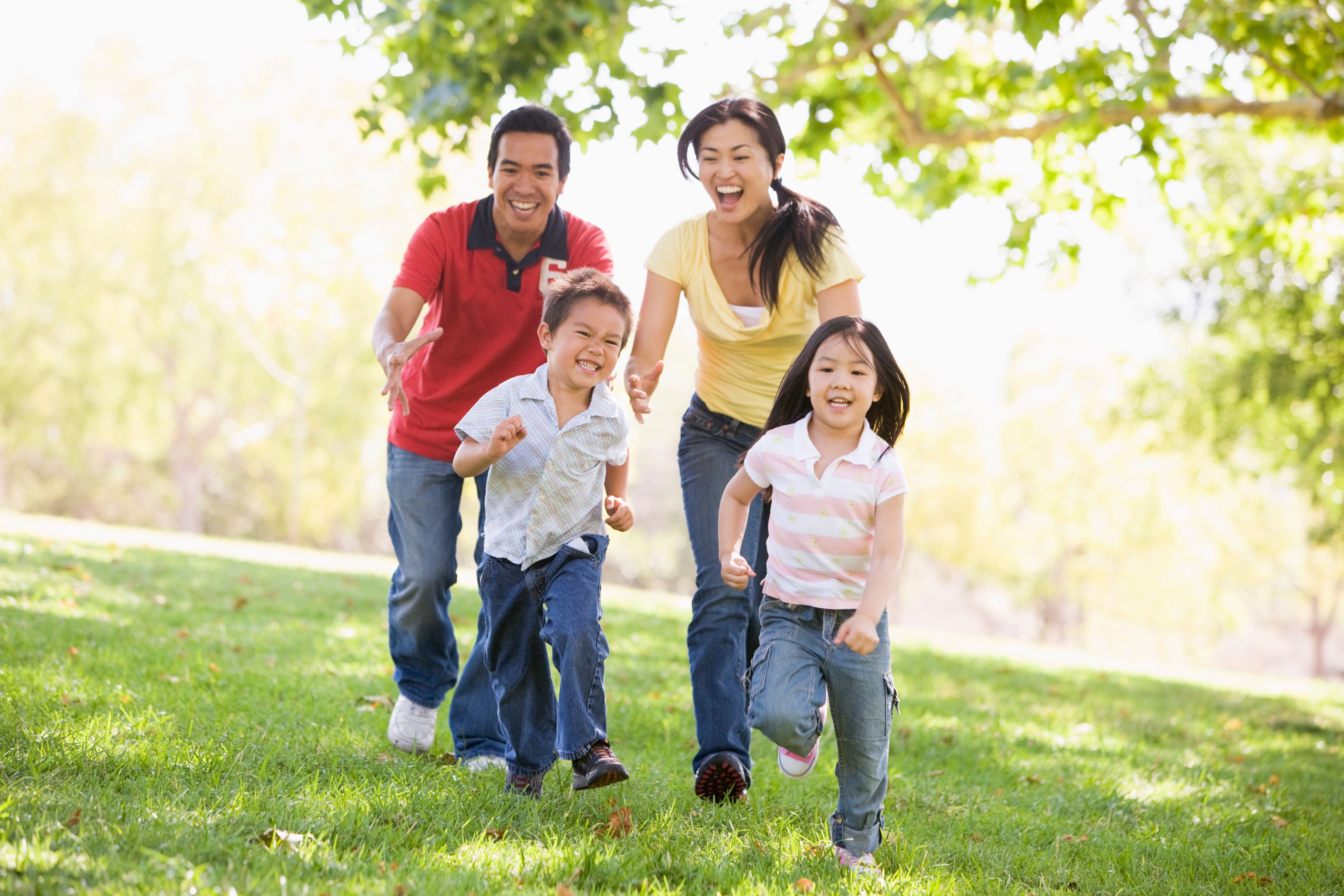 A family running in a field