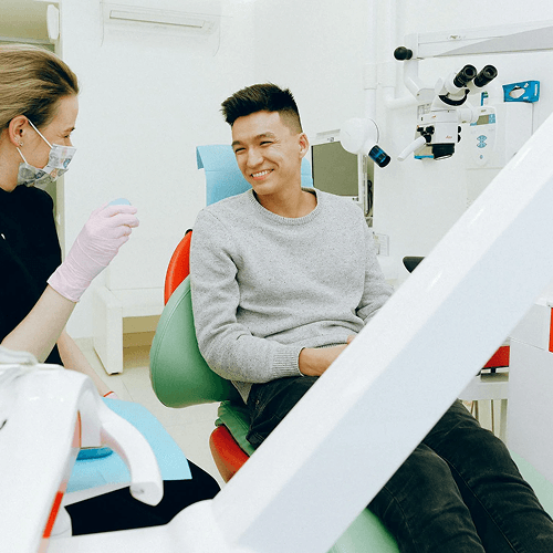 A man sitting for a dental exam