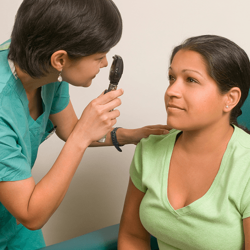 A woman getting an eye exam
